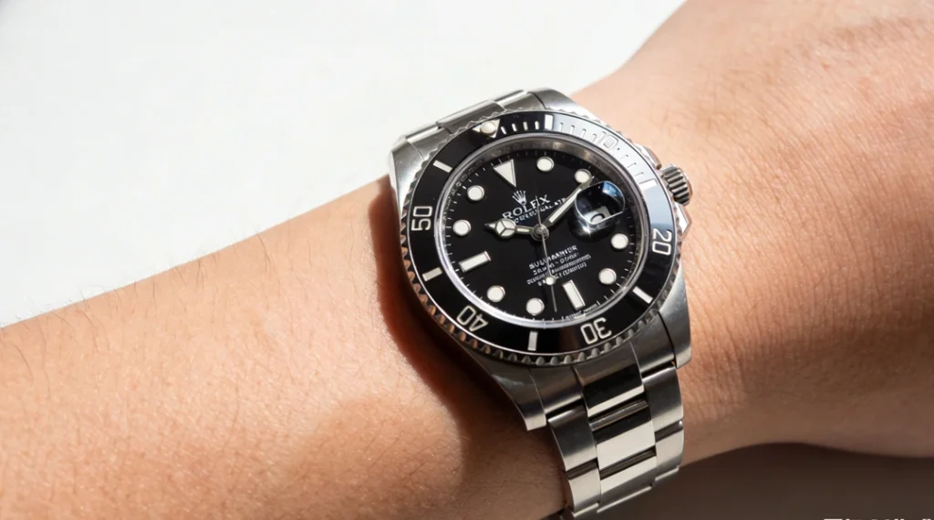 Luxury rolex replica style watch on wrist with stainless steel case and black dial